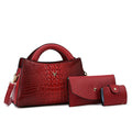 Women's square black crocodile pattern PU crossbody bag with shoulder strap and external pocket.