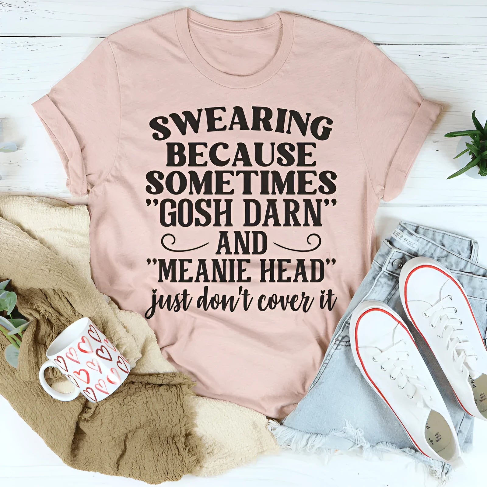 Pink unisex casual t-shirt with short sleeves and a printed design on a solid colour background.