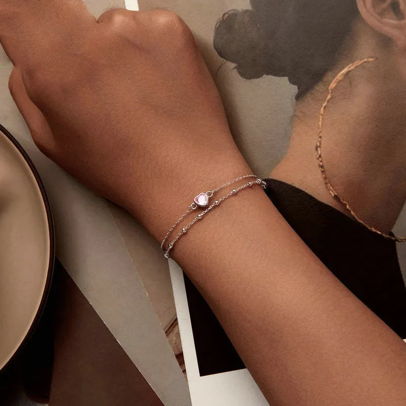 Sweet girlish style 925 sterling silver bracelet with heart pendant on adjustable chain.