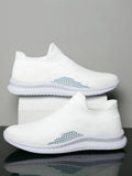 Men's white low-top fabric casual sneakers with a flat heel and round toe on a plain background.