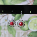 Handmade Tibetan silver earrings with turquoise geometric flower disk design in Miao ethnic style