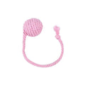 Green cat toy ball with attached rope and internal bell next to a pink one.