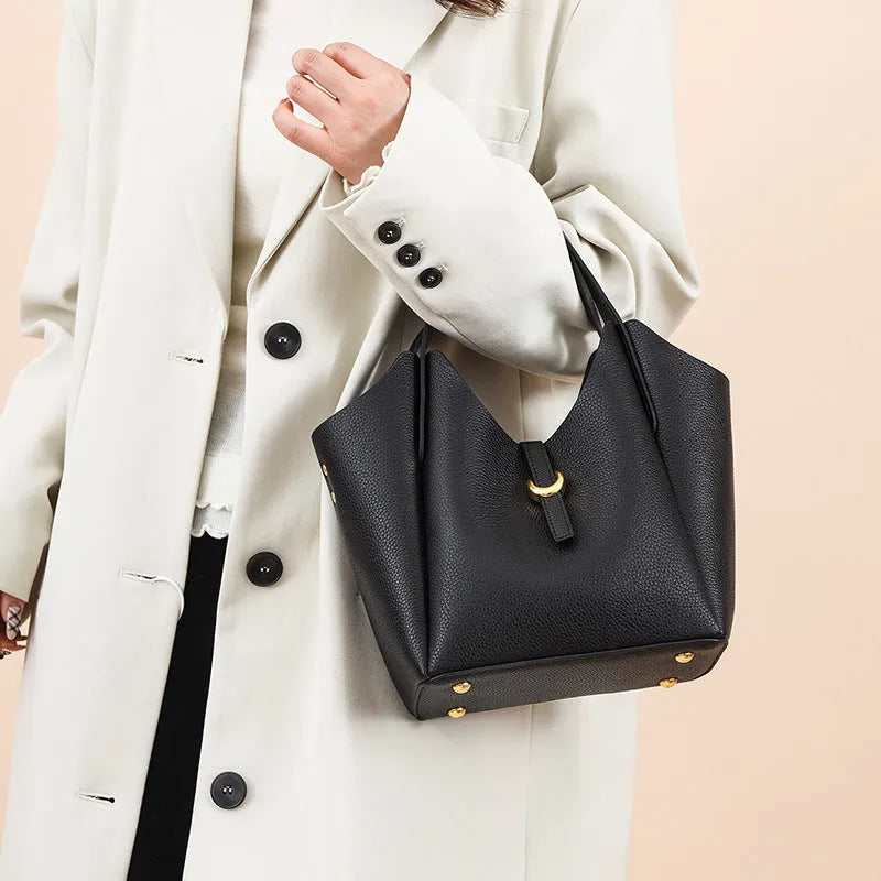 Genuine leather women's hand holding bucket bag in retro style with file bag interior