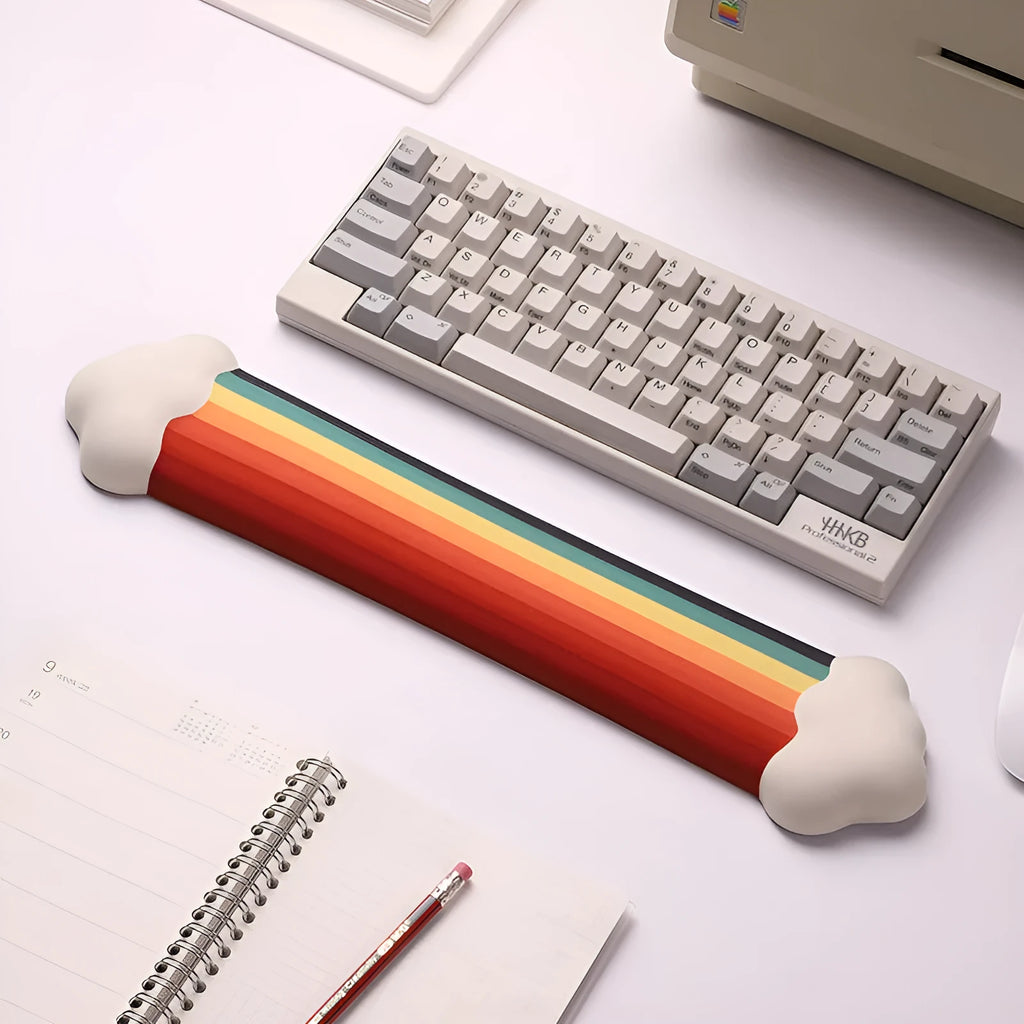 Silicone gel wrister mouse pad and keyboard support set with white cloud pattern on a desk.
