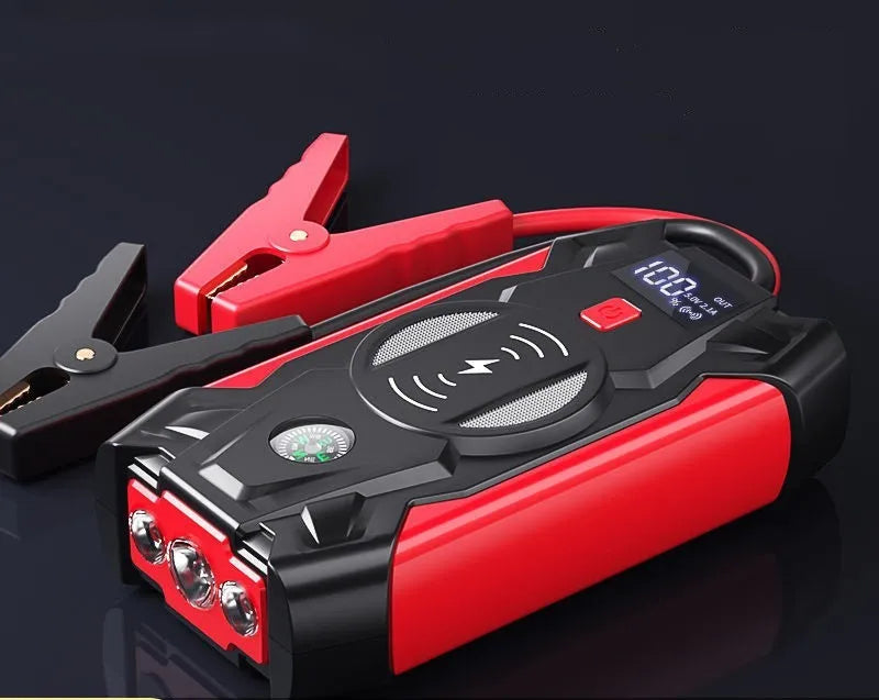 Red car emergency jump starter with thick battery clips and storage box showing 39800W power rating
