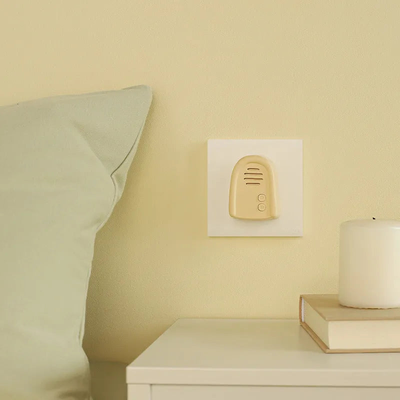 Wireless plug-in doorbell for households in milky yellow or white colour with self-generating beeper