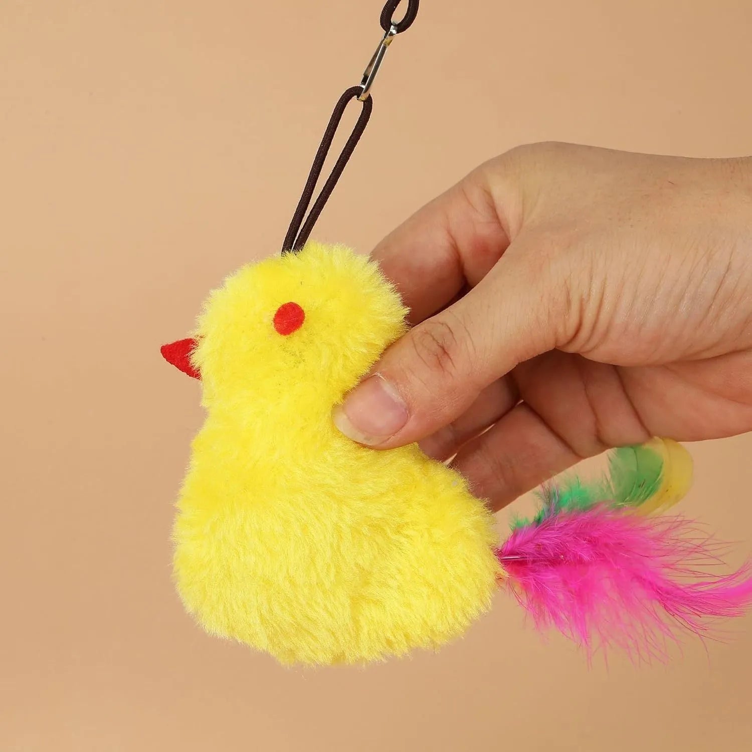 Interactive cat toy hanging from door frame with dangling mouse toy and elastic rope extending downward