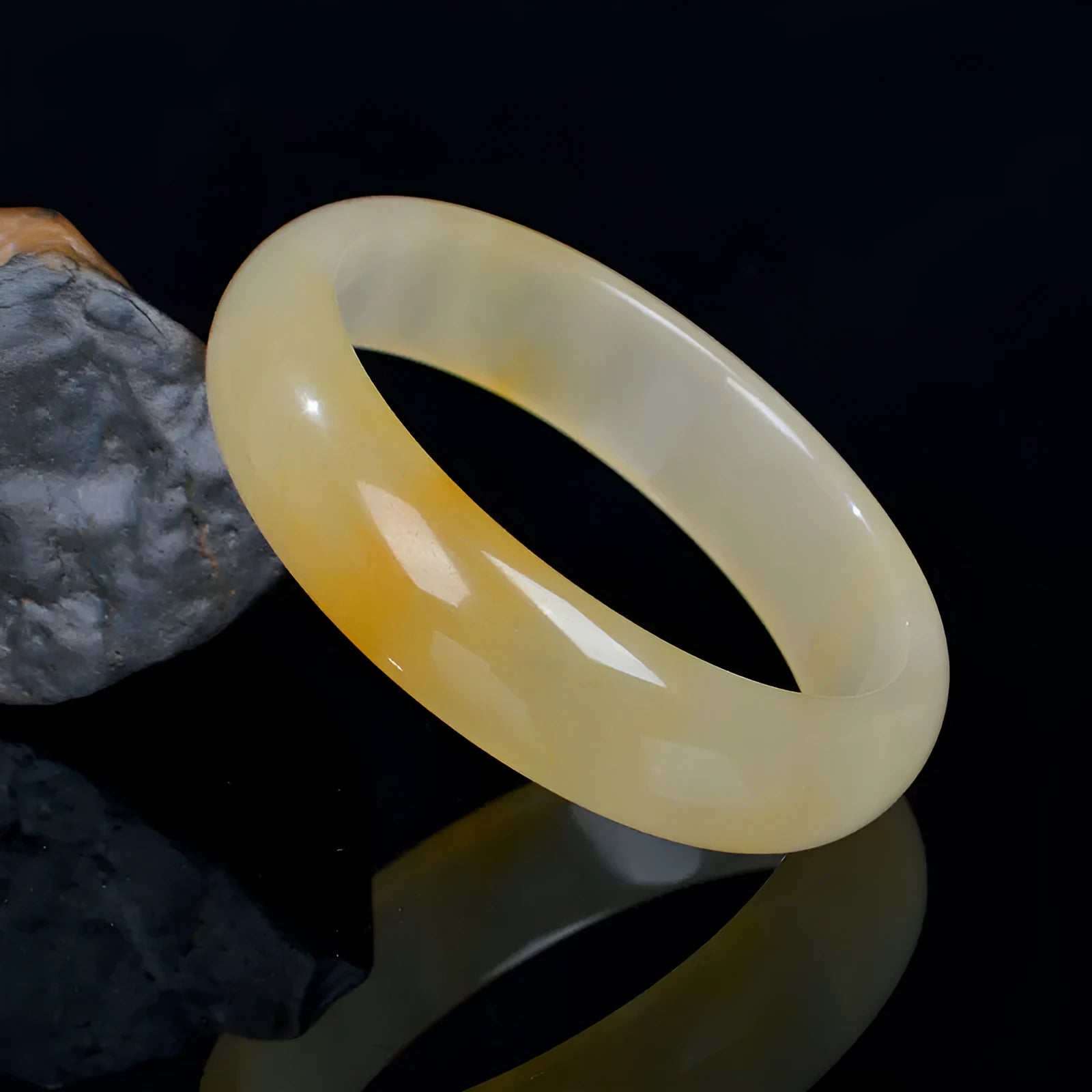 Natural gem light jade bracelet in Chinese style with polished surface showing traditional ornament form