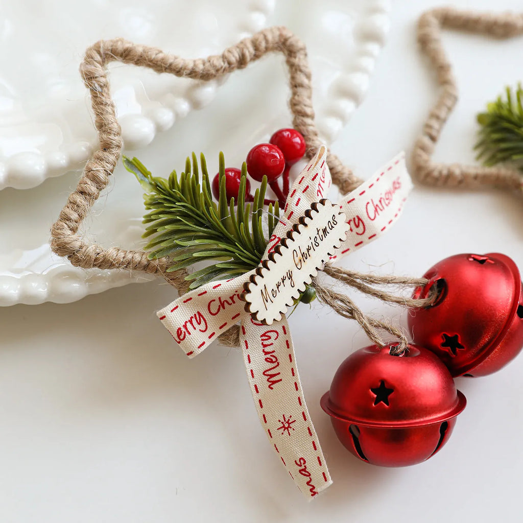 Iron Christmas bell ornament in gold on white background