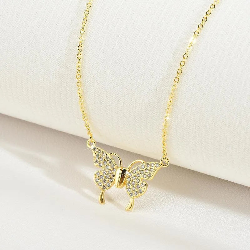 Gold titanium steel clavicle necklace with magnetic snap butterfly charm on twisted chain