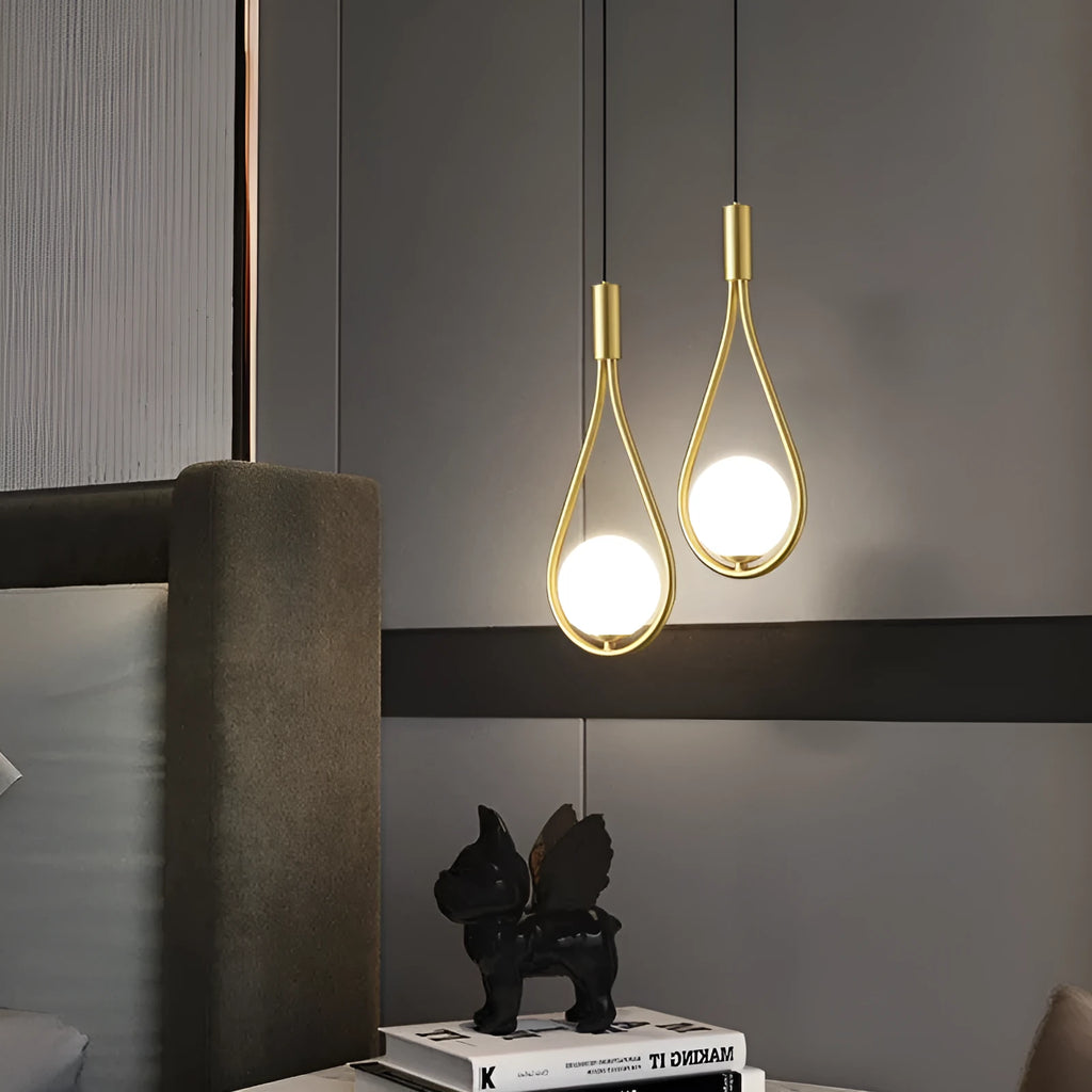 Modern copper bedside chandelier with adjustable hanging cord in minimalist bedroom setting