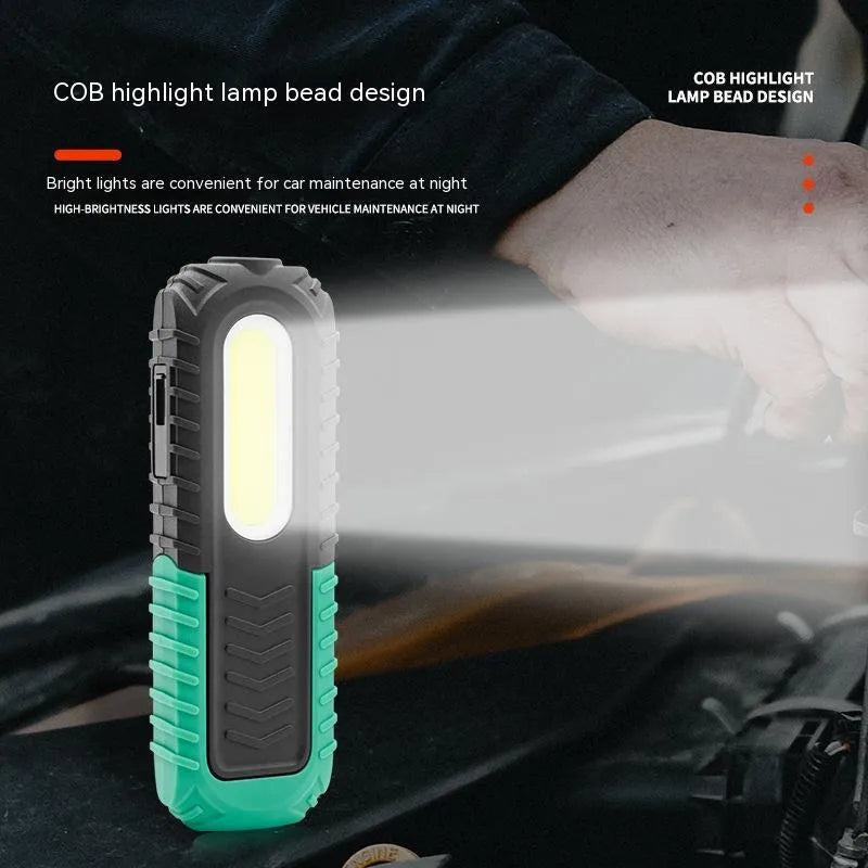 Black and green auto repair work light with PET coating for drop resistance