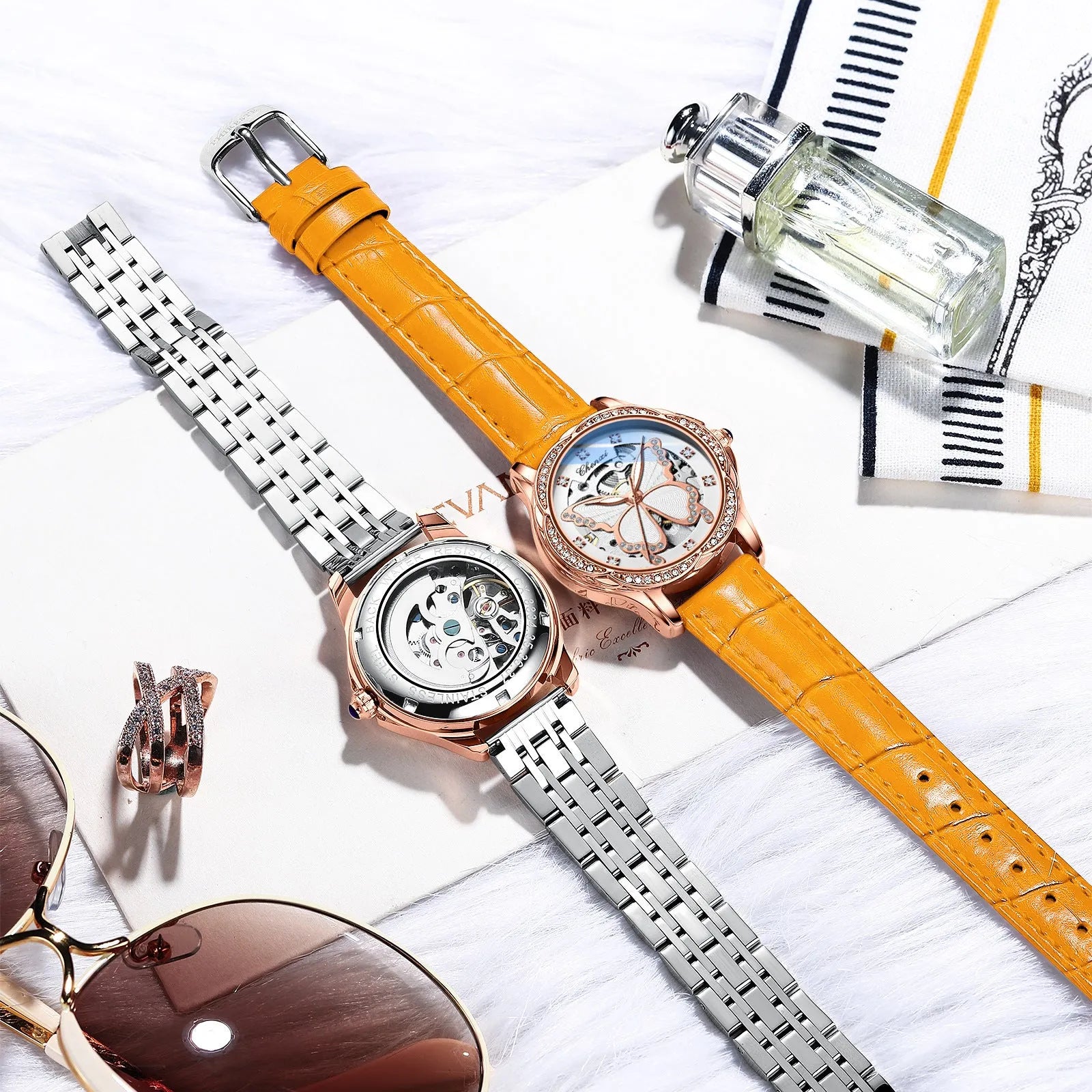 Butterfly dial diamond-embedded women's automatic mechanical watch with genuine leather strap and pin buckle on a white background