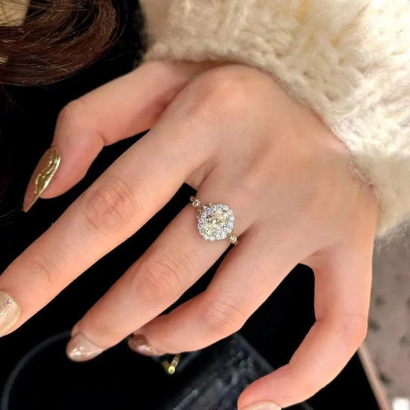 Silver geometric women's ring with large diamond centrepiece and adjustable opening.