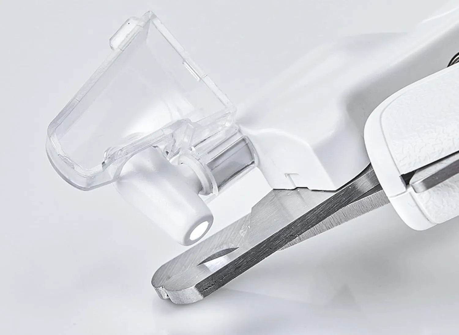 White pet nail clippers with built-in LED light and transparent anti-splash guard.