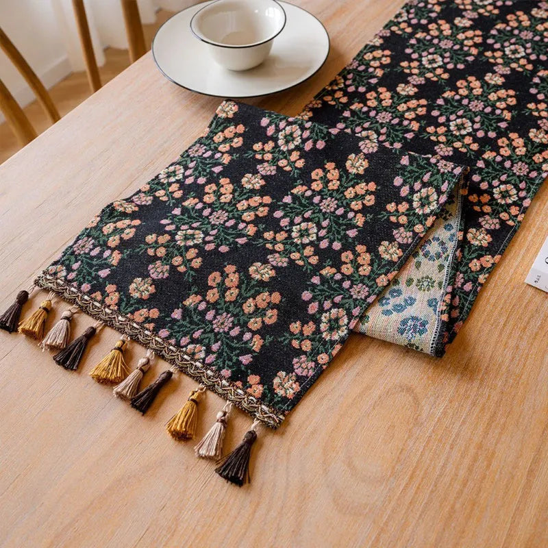 Nordic jacquard stripe pattern table runner with tassel fringe in dark blue.