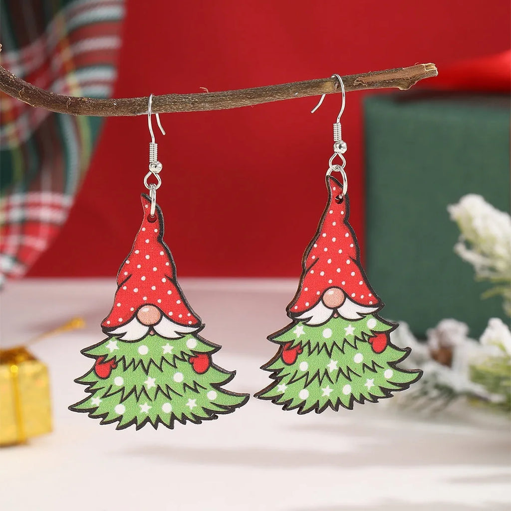 Wooden Christmas earrings with geometric shapes featuring printed Christmas tree and snowman Santa Claus designs