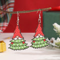 Wooden Christmas earrings with geometric shapes featuring printed Christmas tree and snowman Santa Claus designs