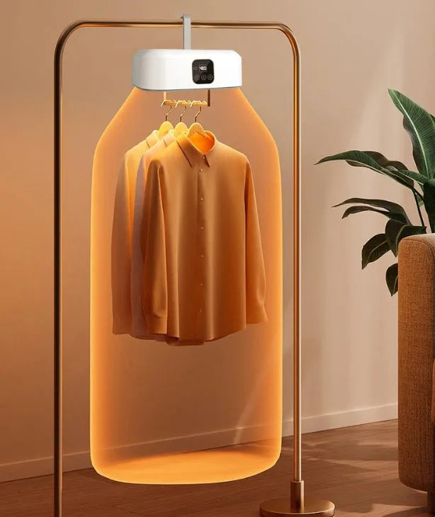 White cylindrical foldable electric clothes dryer with remote control, shown in open position