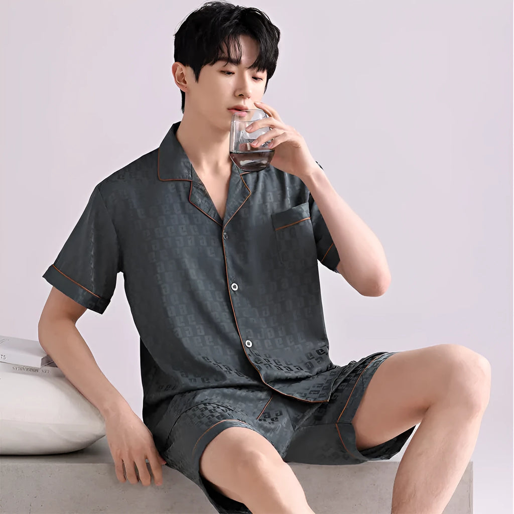 Men's lightweight ice silk pyjama set in a blue houndstooth satin jacquard pattern, showing cardigan top and shorts.