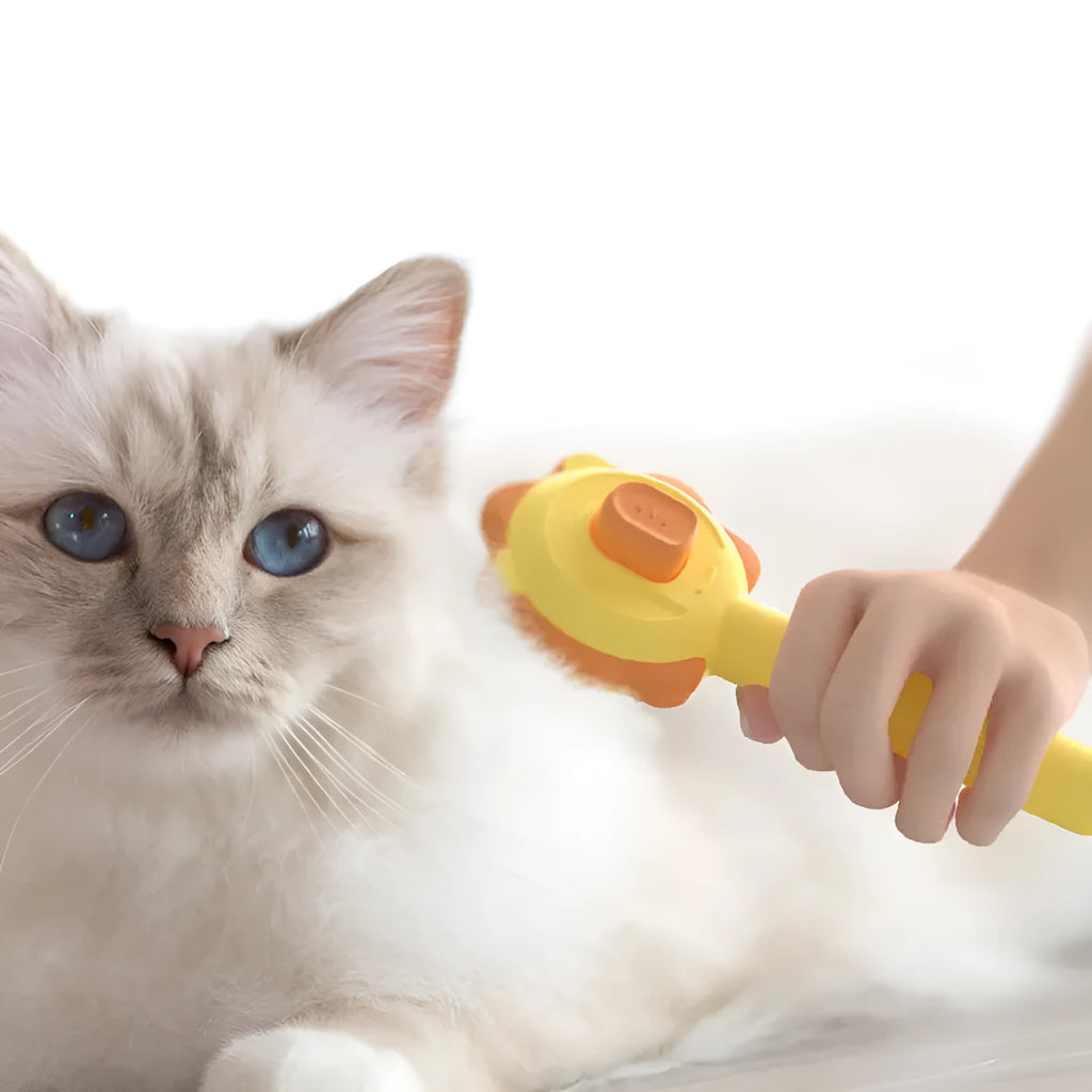 Stainless steel pet comb with one-click hair removal in blue, pink, and yellow colours on white background
