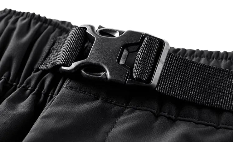 Men's black multi pocket cargo pants in polyester, loose fit, mid-waist style, on white background