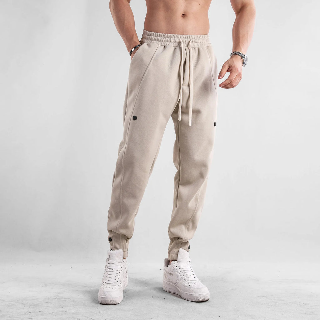 Men's cotton loose fit casual sports trousers in light blue, side view, with mid waist and straight leg