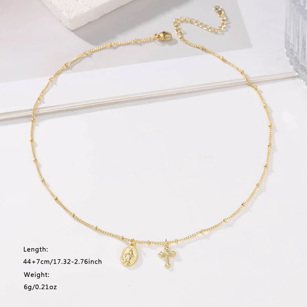 Gold Virgin Mary cross necklace with geometric design on chain