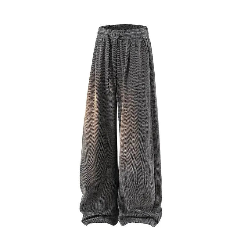 Light gray fleece-lined straight-leg trousers with a hollow-out design on a hanger.