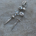 Geometric long pendant earrings with rhinestone drops in antique silver finish.