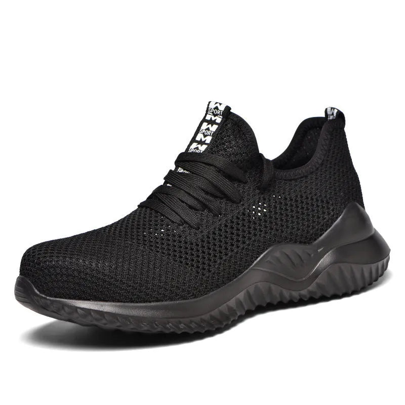 Steel toe cap safety work shoes in black with low-cut design, shown on a work site background.