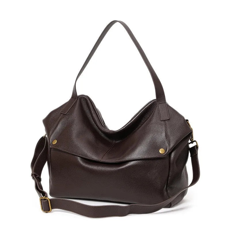 Brown genuine leather women's shoulder bag with horizontal square shape showing interior zipper compartment