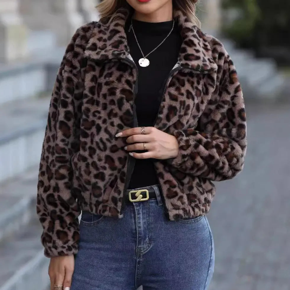 Women's loose leopard print plush coat with front zip and raglan sleeves on a hanger