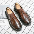 Men's black and brown artificial PU brogue business shoes with round toe on a white background.