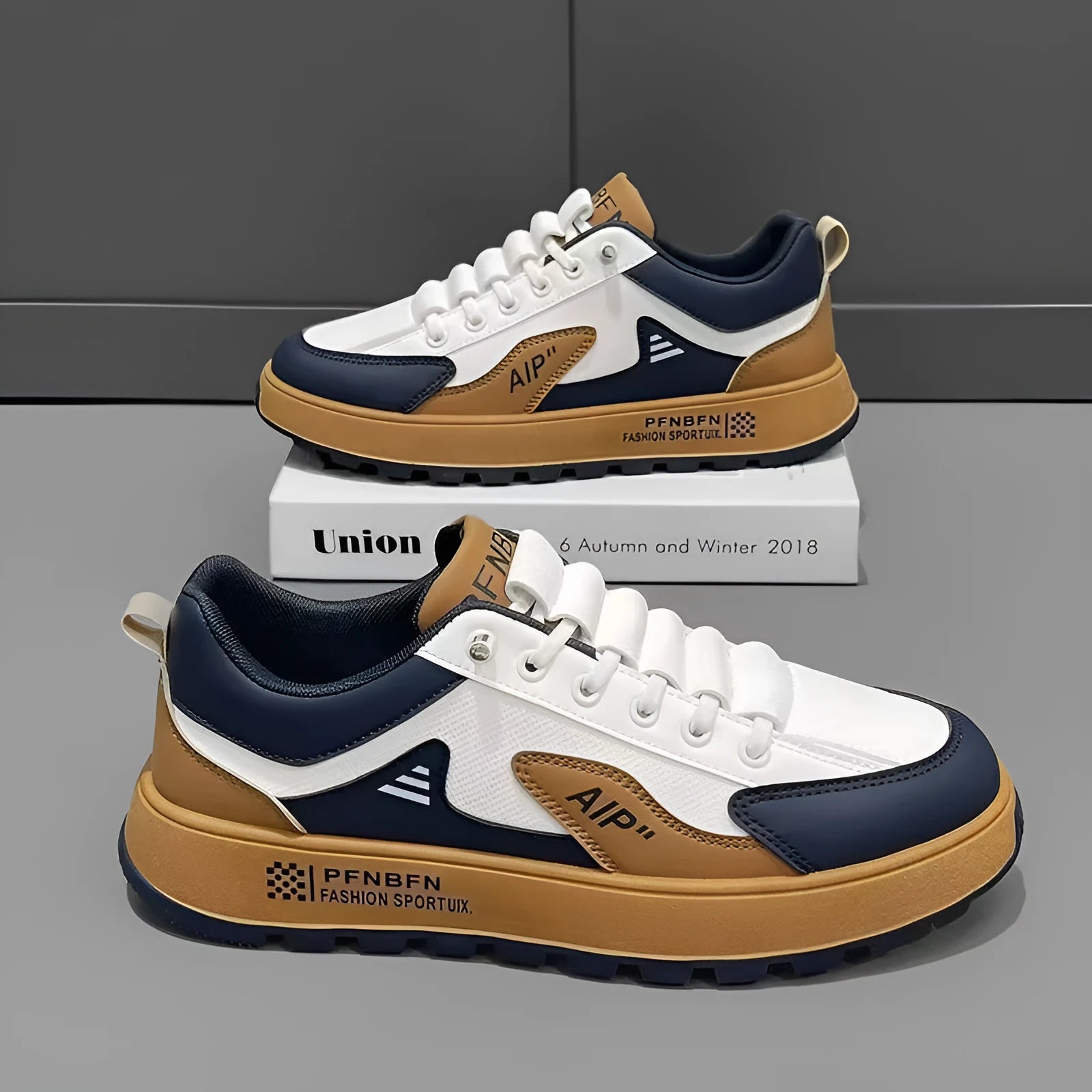 Men's white and orange artificial PU casual shoes with round toe on a solid background.