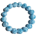 Unisex blue pearl and natural crystal sea-pattern stone bodhi bracelet on a wrist, showing Maillard style design.