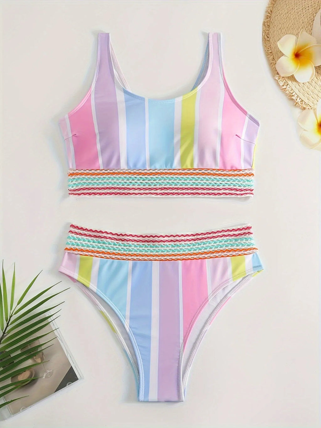Women's striped sport bikini top and briefs on a white background.