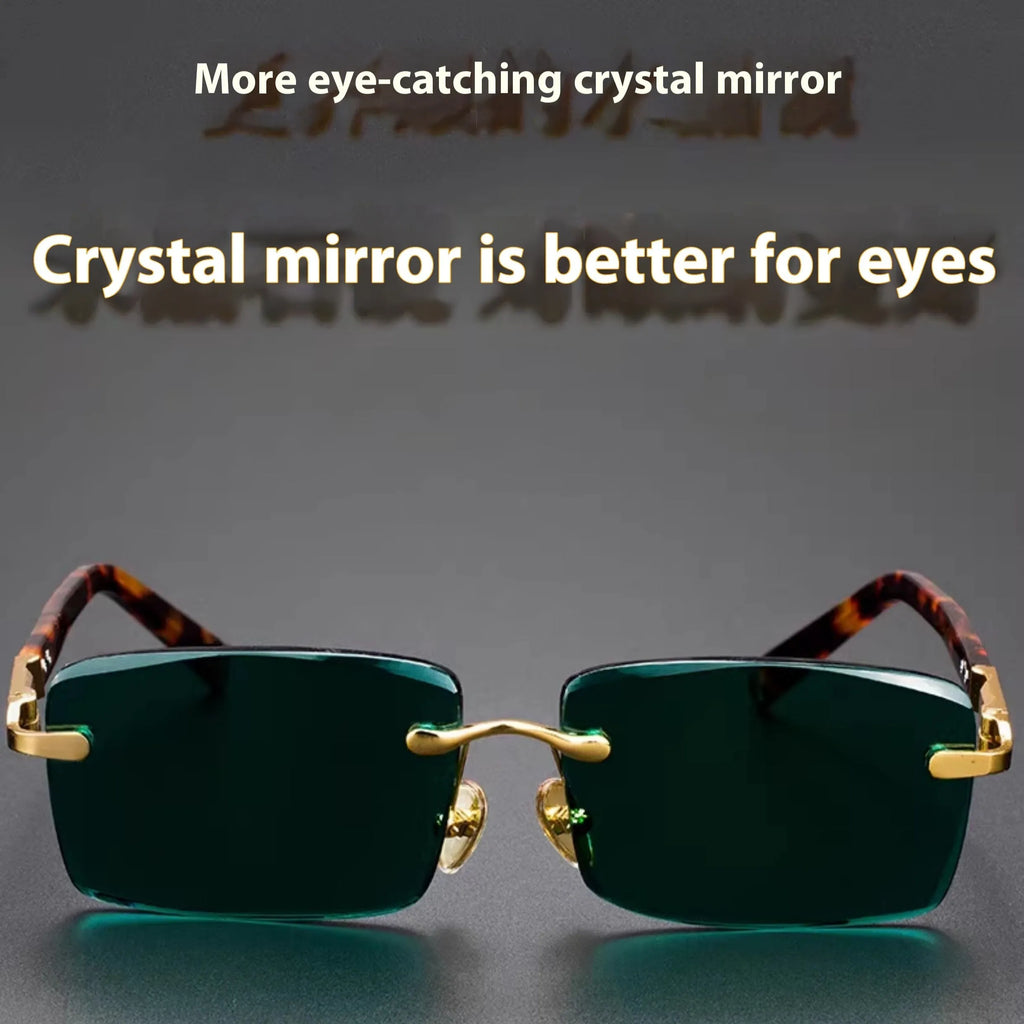 Frameless dark green crystal sunglasses shown with a glasses case and a lens cloth.