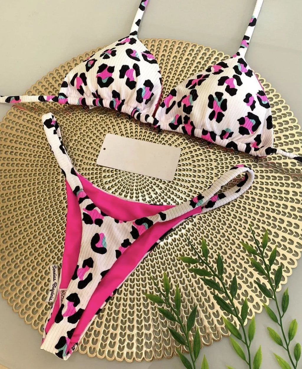 Women's printed bikini swimsuit with cotton lining on mannequin showing briefs style