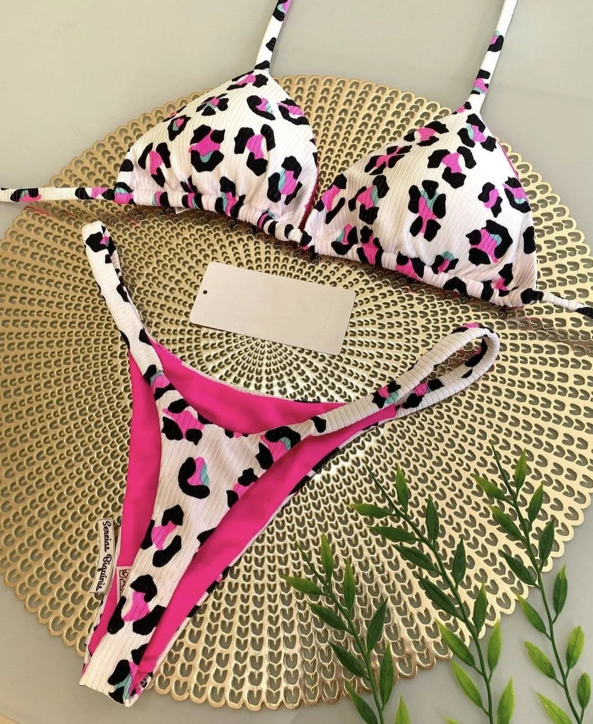 Women's printed bikini swimsuit with cotton lining on mannequin showing briefs style