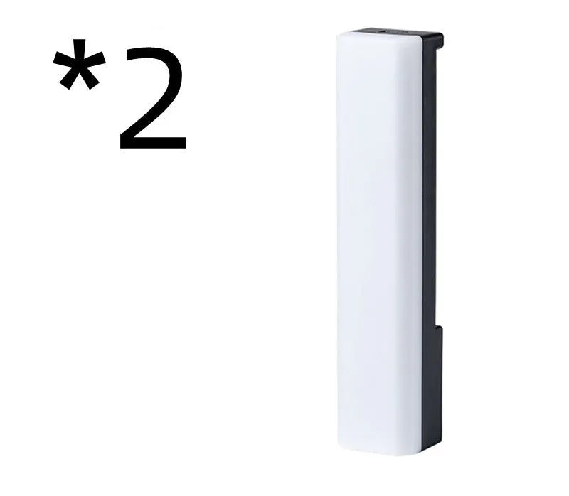 Black and white 3D RGB music rhythm ambiance lamp on a table with USB cable.