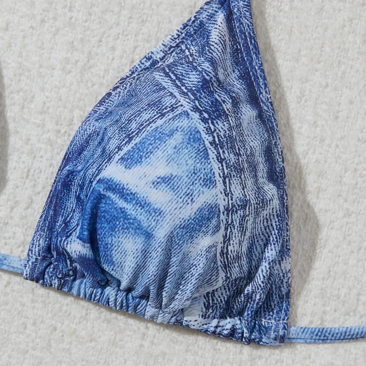 Women's denim blue printed strappy bikini set showing front view of two-piece swimwear
