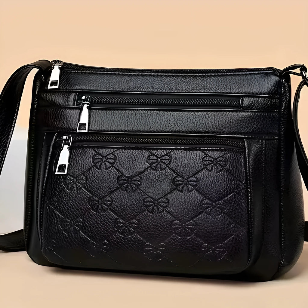 Butterfly Black horizontal square PU crossbody bag for women with external slit pocket and embossed detail