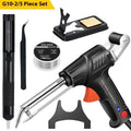 Black G102 alloy soldering gun with light, part of a five-piece kit on a workbench.