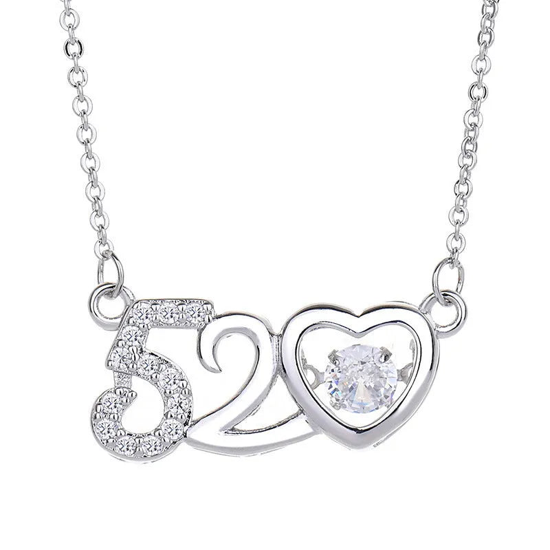 Sterling silver heart pendant necklace with crown and bow detailing in rose gold finish