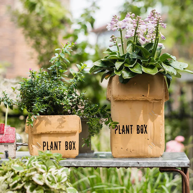 Cement flowerpot with paper carton aesthetic and drainage hole in Nordic style for indoor plants