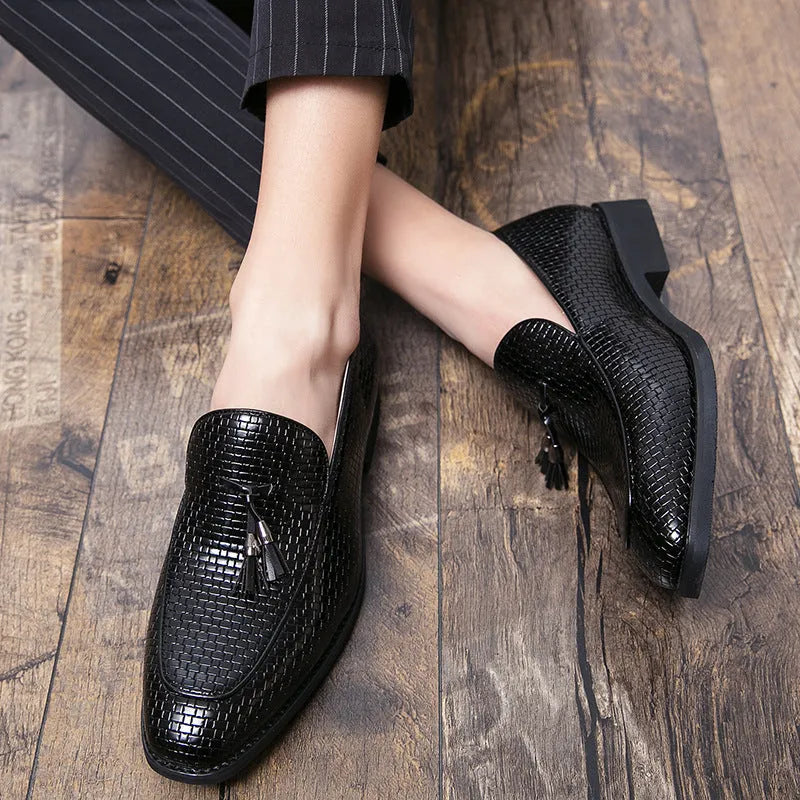 Men's black slip-on business shoes with pointed toe and tassel detail