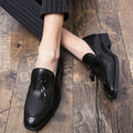 Men's black slip-on business shoes with pointed toe and tassel detail