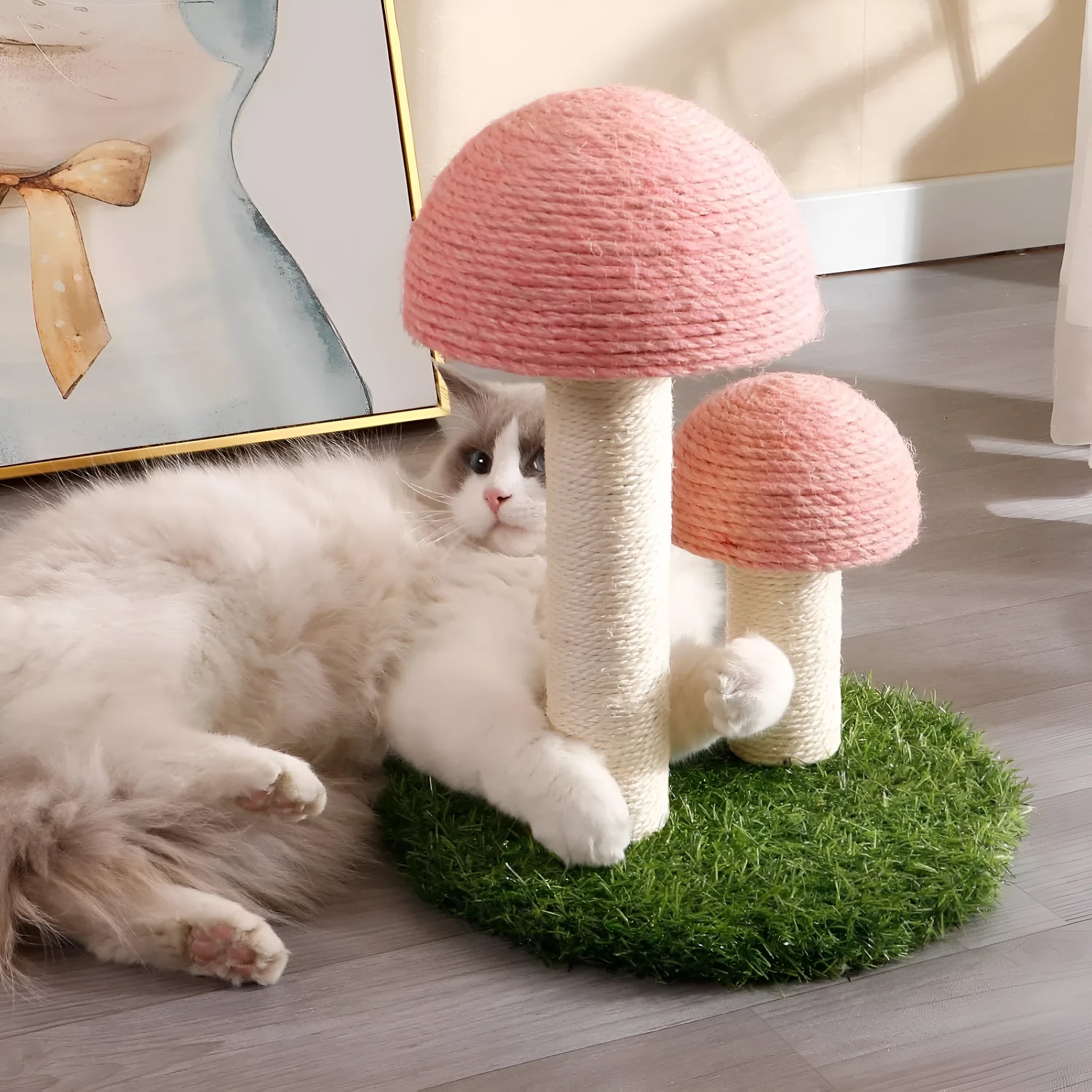 Pink mushroom-shaped cat scratching post with natural sisal covering on cap and pole