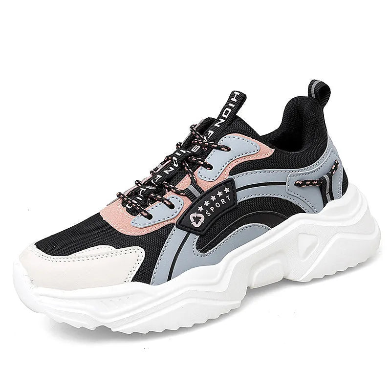 White women's casual mesh sports shoe with thick sole, buckle detail, and round toe.